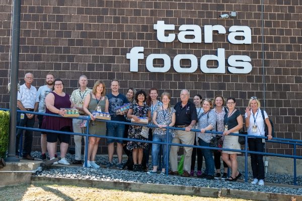Influencers from UK, Holland and Germany with the Tara Foods Team standing outside the factory